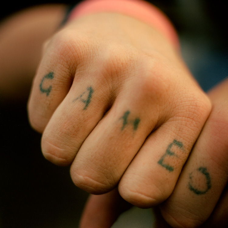 © Chris Hoare,  'Game Over' tattooed on a man's hands outside Tankerville Hotel VIP section, commonly the area of the pub that caters for gamblers, Melbourne.